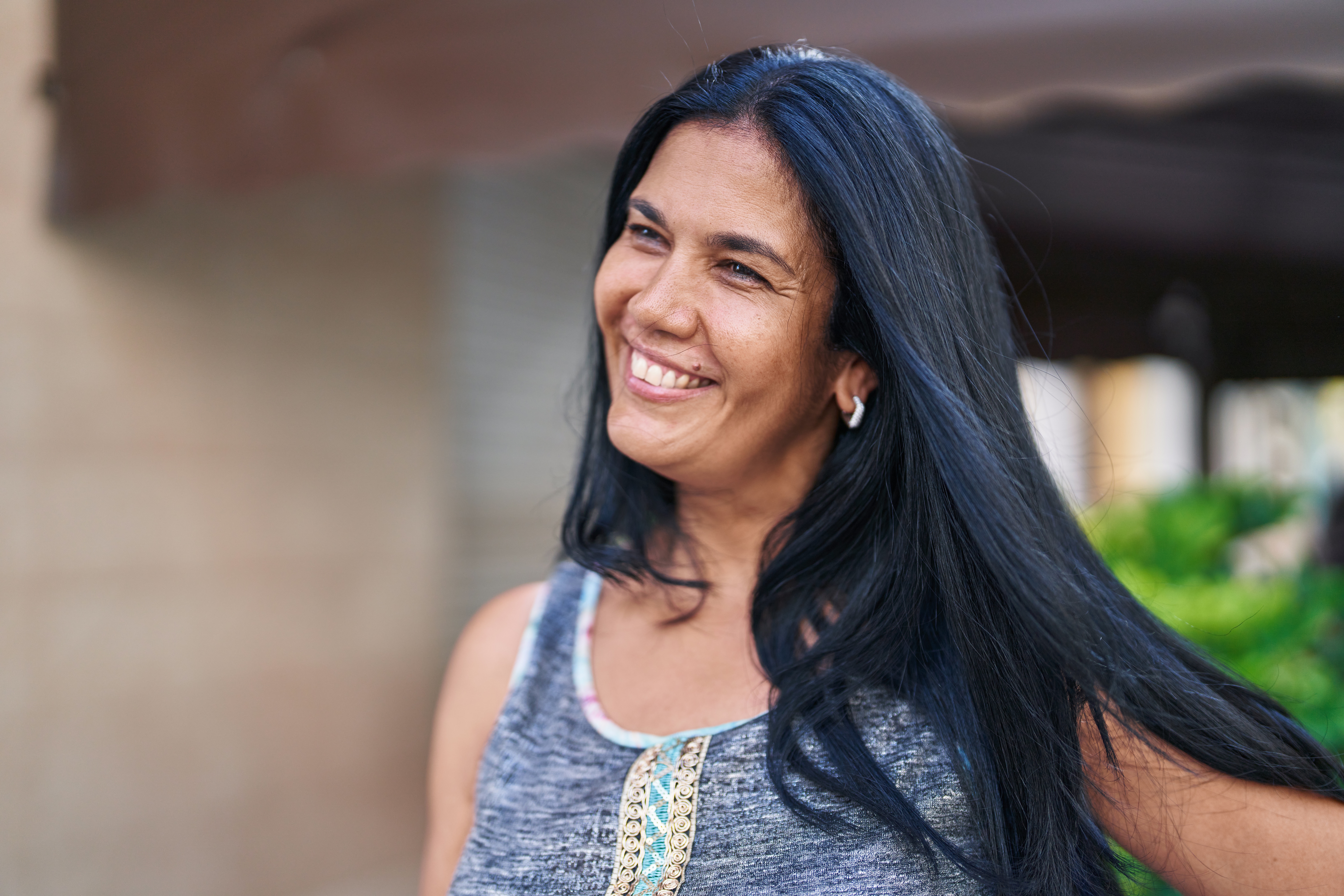 Smiling woman in Bakersfield sharing her experience after receiving help following a personal injury accident