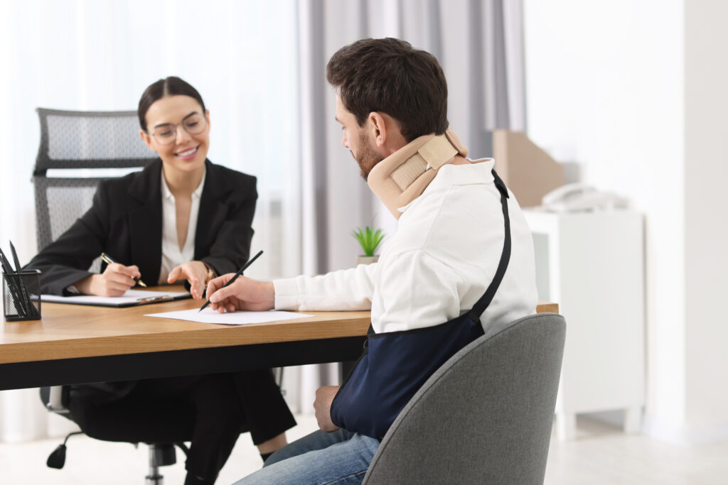 Injured client meeting with a personal injury lawyer for a legal consultation in California.