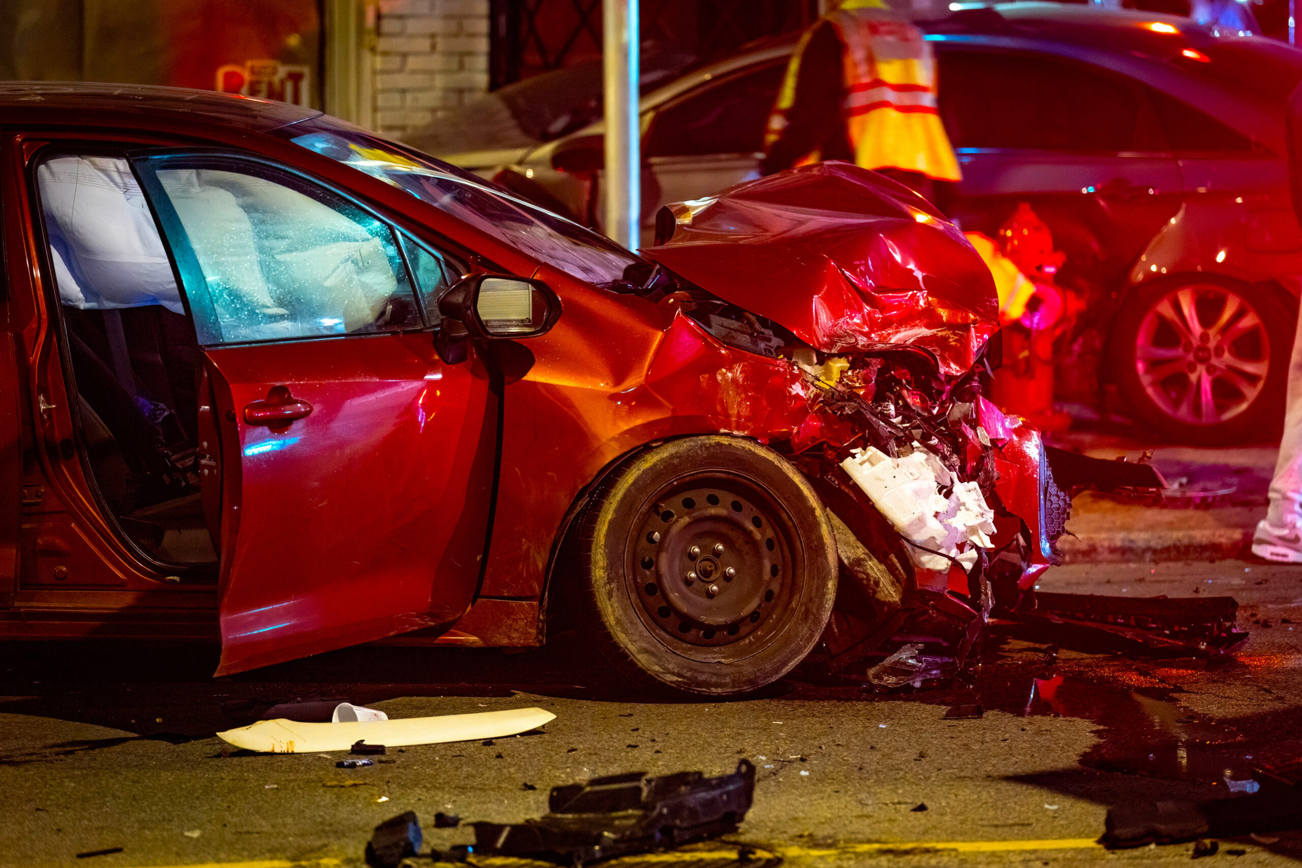 Severe nighttime California car accident with heavy front-end vehicle damage
